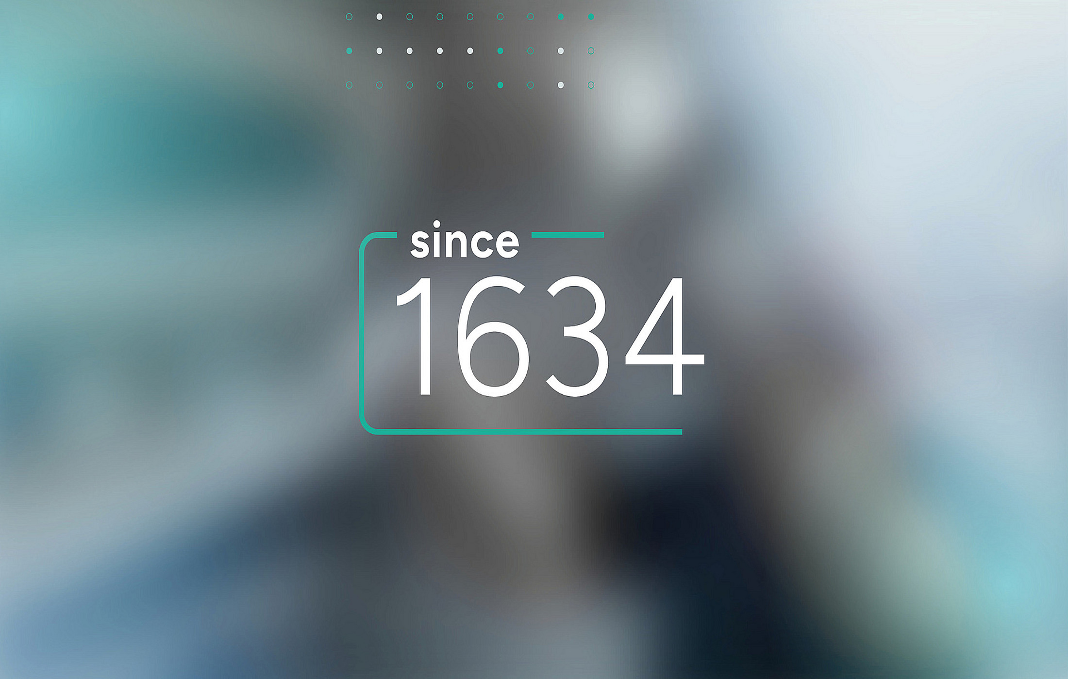 Graphic with the text since 1634 and turquoise elements against a blurred background.